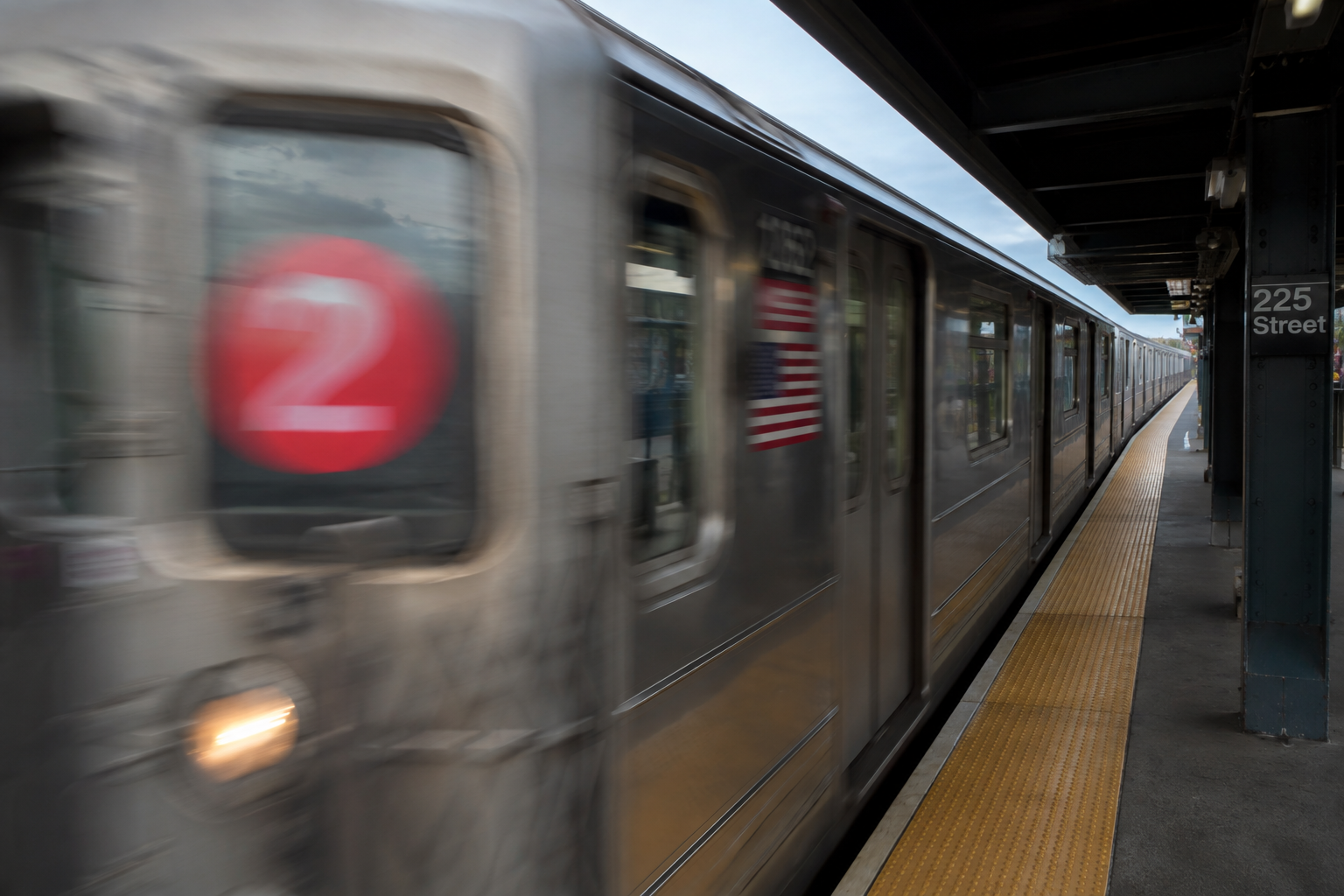 A 2 train entering a Bronx station on the IRT White Plains Road line.