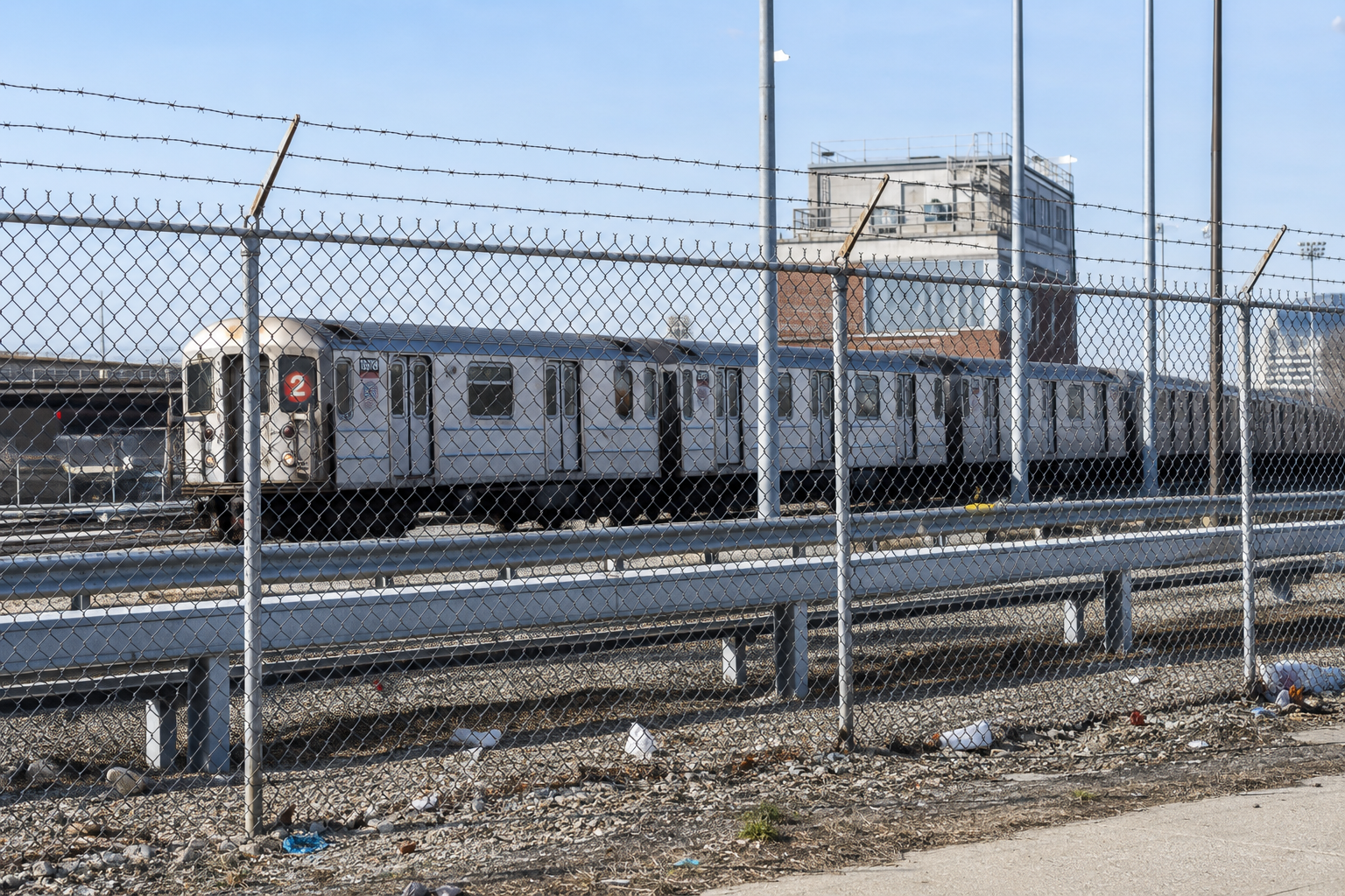 Subway cars parked at an above-ground layup in the Bronx.