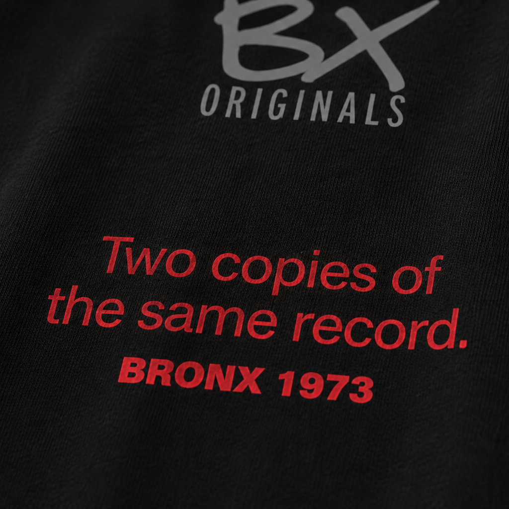 Close-up of the Loop Tee back print, Two copies of the same record, Bronx 1973