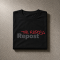 Folded black Repost Tee showing THE REPOST handstyle over charcoal Repost